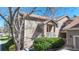 Charming townhouse featuring a cozy front porch and well-maintained landscaping at 7700 W Grant Ranch Blvd # 4A, Littleton, CO 80123