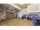 Spacious unfinished garage with ample room for parking, storage, and projects at 7700 W Grant Ranch Blvd # 4A, Littleton, CO 80123
