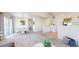 Inviting open-concept living and dining area with neutral tones and ample natural light at 7700 W Grant Ranch Blvd # 4A, Littleton, CO 80123