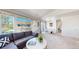 Bright open-concept living and dining area, showcasing natural light and comfortable seating at 7700 W Grant Ranch Blvd # 4A, Littleton, CO 80123