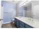 Modern bathroom featuring a double sink vanity, quartz counters, and a shower-tub combination at 7090 Simms St # 202, Arvada, CO 80004