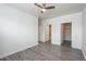 Spacious bedroom featuring wood-look floors, two closets and neutral walls at 7090 Simms St # 202, Arvada, CO 80004