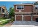 Two-story townhouse with brick accents and a convenient two-car garage at 7090 Simms St # 202, Arvada, CO 80004