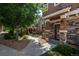 Charming townhouse complex with well-maintained landscaping and inviting walkways at 7090 Simms St # 202, Arvada, CO 80004