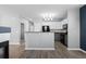 Spacious floor plan with kitchen including stainless appliances and stylish gray cabinets at 7090 Simms St # 202, Arvada, CO 80004