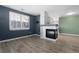 Contemporary living area features a fireplace and open floor plan with neutral tones at 7090 Simms St # 202, Arvada, CO 80004