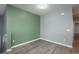 Well-lit room with muted wall colors and gray, wide-plank flooring at 7090 Simms St # 202, Arvada, CO 80004