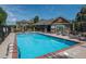 Community pool featuring clear blue water, comfortable lounge chairs, and well-maintained surroundings at 7090 Simms St # 202, Arvada, CO 80004