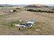 Bird's eye view of a farm house and barn with open land at 12747 Bestview Dr, Larkspur, CO 80118