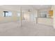 Spacious finished basement with neutral carpet, bright windows and a ceiling fan at 12747 Bestview Dr, Larkspur, CO 80118