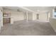 Expansive finished basement with a wet bar, neutral carpet and recessed lighting at 12747 Bestview Dr, Larkspur, CO 80118