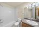 Clean bathroom features a shower-tub combo and large mirror at 12747 Bestview Dr, Larkspur, CO 80118