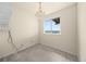 Cozy bedroom with a chandelier, neutral carpet, and large window with scenic views at 12747 Bestview Dr, Larkspur, CO 80118