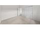 This bedroom features neutral carpet, white walls, and a double door closet at 12747 Bestview Dr, Larkspur, CO 80118