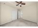 Bright bedroom with neutral walls, carpet, ceiling fan and closet at 12747 Bestview Dr, Larkspur, CO 80118