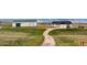 Scenic driveway leads to a home and barn in a serene landscape at 12747 Bestview Dr, Larkspur, CO 80118