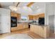 Modern kitchen with wood cabinets, stainless appliances and vaulted ceilings at 12747 Bestview Dr, Larkspur, CO 80118