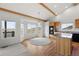 Eat-in kitchen with plenty of natural light, wood cabinets and vaulted ceiling at 12747 Bestview Dr, Larkspur, CO 80118