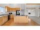 Charming kitchen with stainless steel appliances and hardwood floors at 12747 Bestview Dr, Larkspur, CO 80118