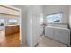 Well-lit laundry room with washer, dryer, cabinetry, and a window with a view at 12747 Bestview Dr, Larkspur, CO 80118