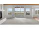 Bright living room featuring a fireplace and large sliding doors to outside deck with beautiful views at 12747 Bestview Dr, Larkspur, CO 80118