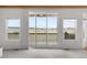 Bright living room featuring large sliding doors to outside deck with beautiful views at 12747 Bestview Dr, Larkspur, CO 80118