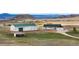 Beautiful home exterior with a large barn, and mountain views at 12747 Bestview Dr, Larkspur, CO 80118