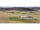 Expansive view of property featuring a house and barn with picturesque landscape and mountain views at 12747 Bestview Dr, Larkspur, CO 80118