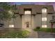 Charming exterior view of building with a well-maintained lawn and manicured landscape at 7395 E Quincy Ave # 206, Denver, CO 80237