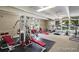 Community gym with exercise equipment and large windows at 7395 E Quincy Ave # 206, Denver, CO 80237