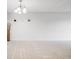 Bright living room featuring white walls, neutral carpet, and elegant chandelier lighting at 7395 E Quincy Ave # 206, Denver, CO 80237