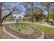 Pool area and grassy area with barbeque pits, picnic tables, and a rock garden at 7395 E Quincy Ave # 206, Denver, CO 80237