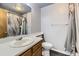 Standard bathroom features a sink, toilet, and tub-shower combination at 10408 Strasburg Way, Parker, CO 80134