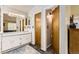 Primary bathroom features a double-sink vanity, and a seperate water closet and shower room at 10408 Strasburg Way, Parker, CO 80134