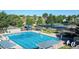 Large community pool with lap lanes, sunshades, and lounge area for residents' enjoyment at 10408 Strasburg Way, Parker, CO 80134