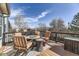 Outdoor deck area features patio furniture, a fire pit, and views of the surrounding neighborhood at 10408 Strasburg Way, Parker, CO 80134