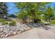 Scenic park pathway with stone accents and lush trees offers a tranquil environment at 10408 Strasburg Way, Parker, CO 80134