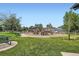 Gathering-friendly playground with green space, benches, and a variety of equipment at 10408 Strasburg Way, Parker, CO 80134