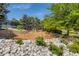 Community playground with swings, slides, and climbing structures amidst landscaped surroundings at 10408 Strasburg Way, Parker, CO 80134