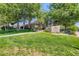 Charming community recreation center entrance with manicured lawn and lush landscaping at 10408 Strasburg Way, Parker, CO 80134