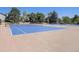 Well-maintained community tennis courts with a light blue playing surface at 10408 Strasburg Way, Parker, CO 80134