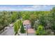 Bird's eye view of neighborhood with mature trees, a two-story home, and mountain views in the distance at 600 Vine St, Denver, CO 80206