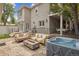 Outdoor living space with fire pit, hot tub, and patio furniture at 600 Vine St, Denver, CO 80206