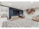 Spacious finished basement with large rug, entertainment area and stylish decor at 600 Vine St, Denver, CO 80206