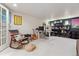 Finished basement area set up as a workspace, with desk, guitar, and shelving at 600 Vine St, Denver, CO 80206