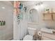 Well-lit bathroom showcasing a tub-shower combo, vanity, and a modern mirror at 600 Vine St, Denver, CO 80206