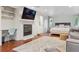 Spacious bedroom featuring a fireplace, desk, and a comfortable seating area with a stylish rug and modern decor at 600 Vine St, Denver, CO 80206