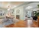 Open concept dining room with hardwood floors, fireplace, and view into the cozy living room at 600 Vine St, Denver, CO 80206