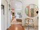 Charming foyer with hardwood floors, open archways, and a view of the kitchen and living room at 600 Vine St, Denver, CO 80206