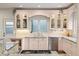Well-appointed kitchen with granite countertops, stainless steel appliances, and a view of the backyard at 600 Vine St, Denver, CO 80206